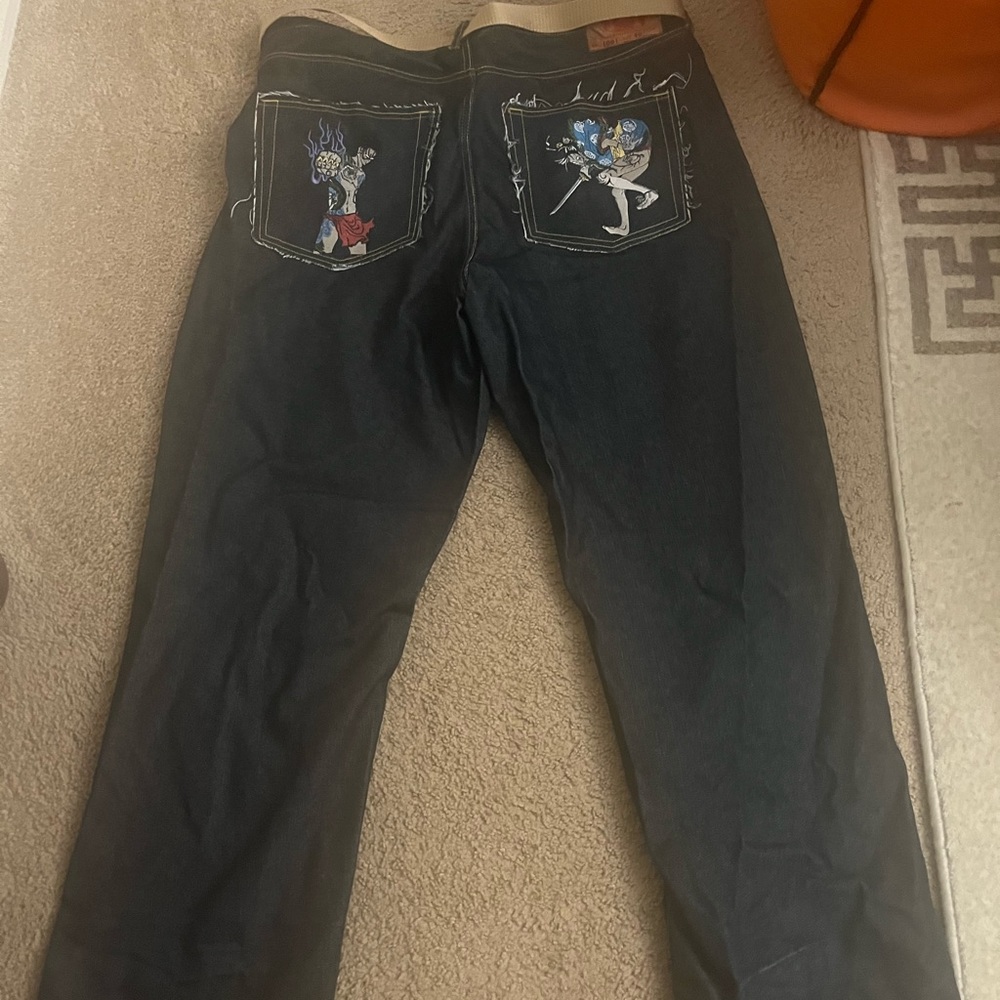 Size 40 red monkey jeans